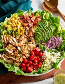 Grilled chicken salad with chicken, bacon, tomatoes, corn, avocado, romaine, red onion and feta.
