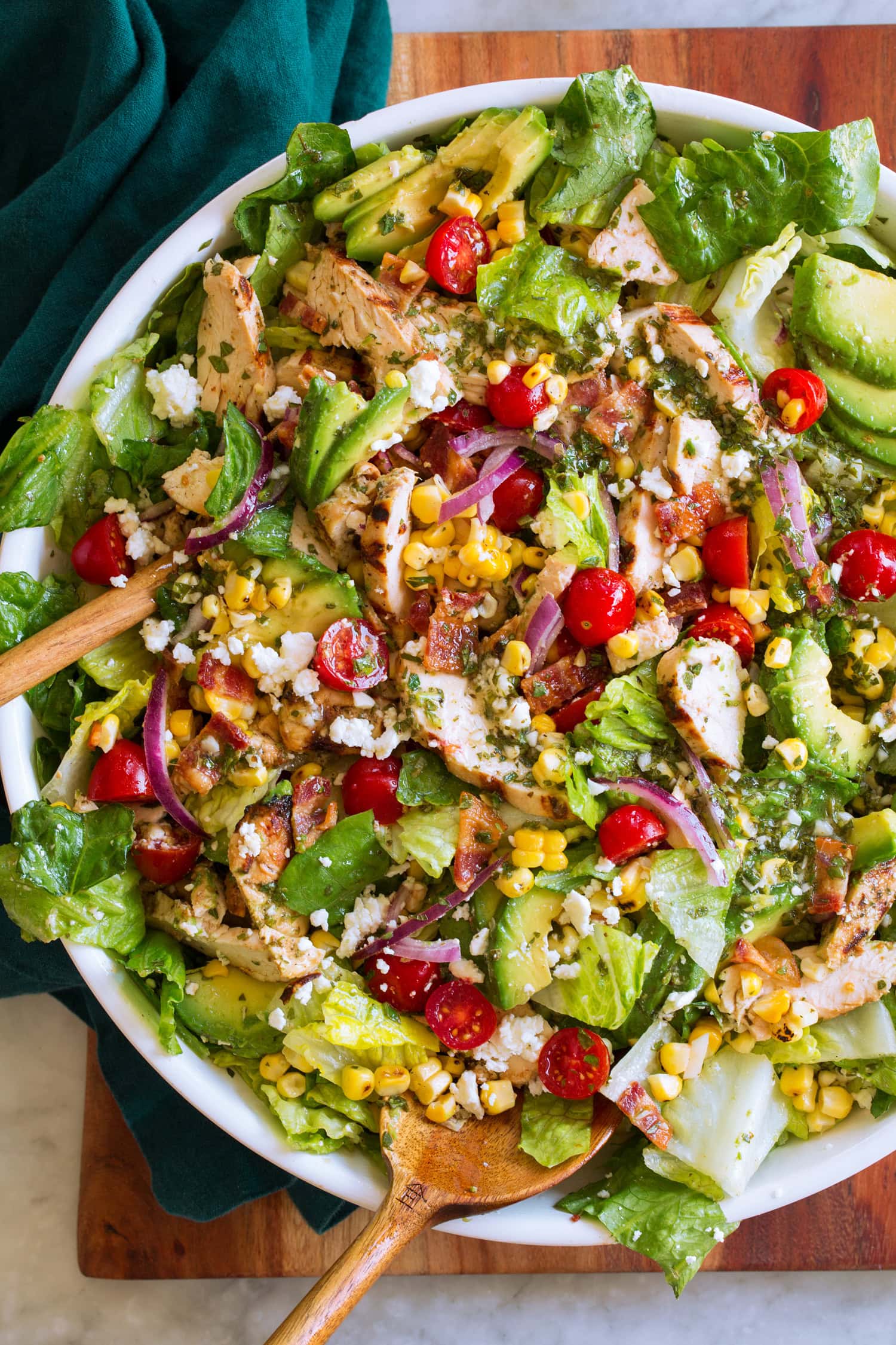 Tossed salad with grilled chicken, tomatoes, corn, avocado and romaine lettuce.