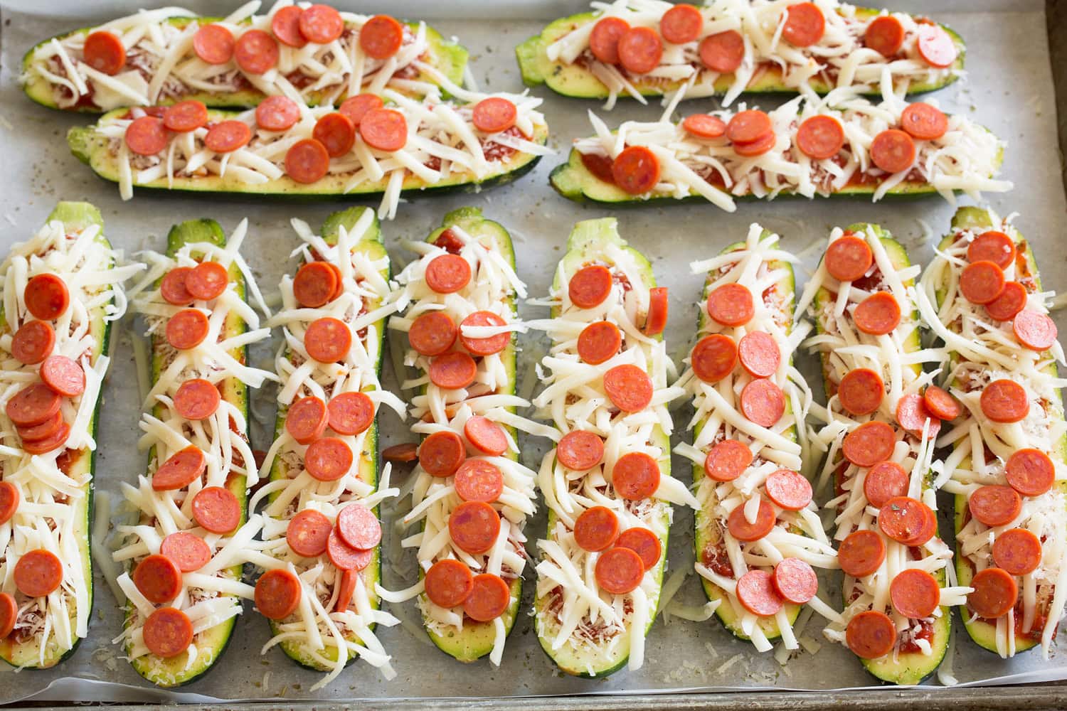 Raw fully prepared zucchini boats before cooking.
